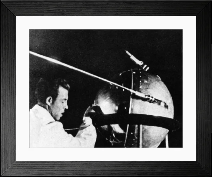 Framed Print : Russian technician with Sputnik 1. The Russian satellite was the first human-made object into space. It was a pressurized sphere made of aluminum alloy launched on Oct. 4, 1957 Framed Print : Russian technician with Sputnik 1. The Russian satellite was the first human-made object into space. It was a pressurized sphere made of aluminum alloy launched on Oct. 4, 1957