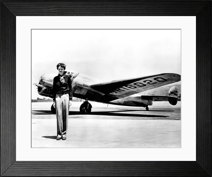 Framed Print : Amelia Earhart standing in front of the Lockheed Electra in which she disappeared in July 29, 1937 Framed Print : Amelia Earhart standing in front of the Lockheed Electra in which she disappeared in July 29, 1937