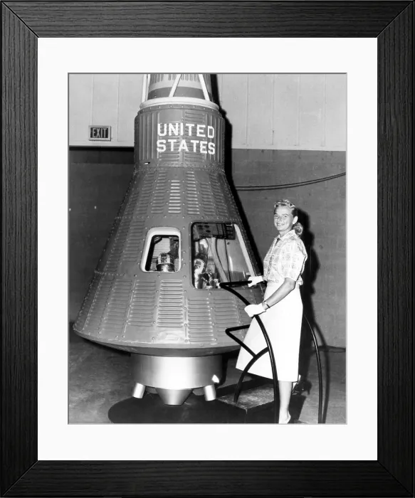 Framed Print : Astronaut Trainees Jerrie Cobb stands next to a Mercury spaceship capsule
