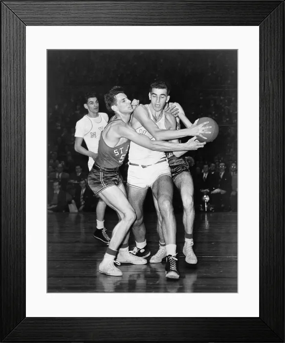 Framed Print : Adolph Dolph Schayes keeping the basketball away from Joe Ossola of St. Louis University, 1948