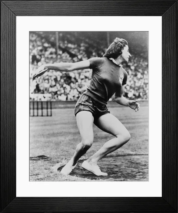 Framed Print : Micheline Ostermeyer, throwing the discus at the 1948 London Olympics. The French athlete won the gold medal only a few weeks after she made her first picked up a discus Framed Print : Micheline Ostermeyer, throwing the discus at the 1948 London Olympics. The French athlete won the gold medal only a few weeks after she made her first picked up a discus