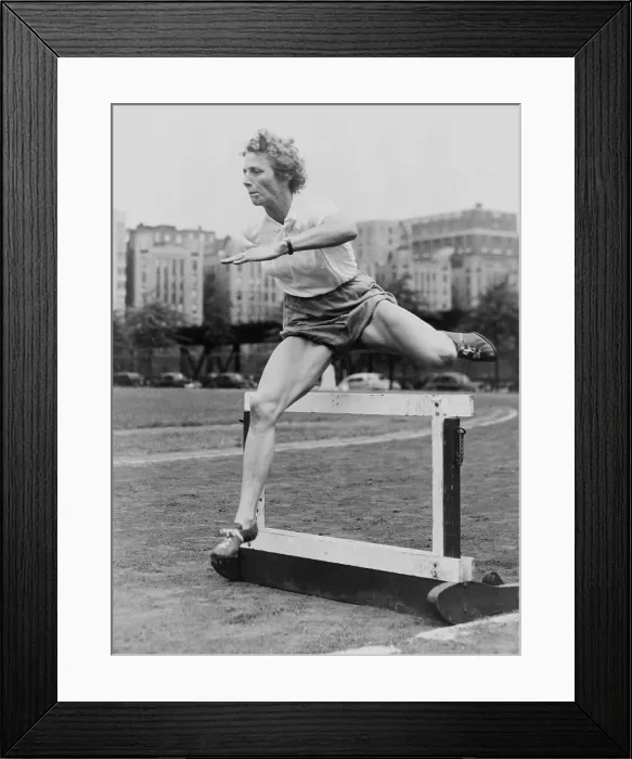 Framed Print : Fanny Blankers-Koen clearing a low hurdle at McCombs Dam Park in the Bronx, 1949