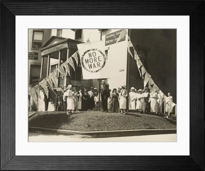 Framed Print : Raising the No More War banner over the HQ of the Council for Limitation of Armaments. July 29, 1922. Attending are mostly women, in Washington, D.C