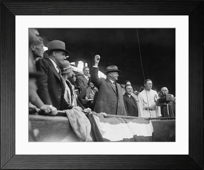 Framed Print : President Herbert Hoover throwing out the ceremonial first pitch at Griffith Stadium in 1929. At right is Manager Walter Johnson, former Senators star pitcher