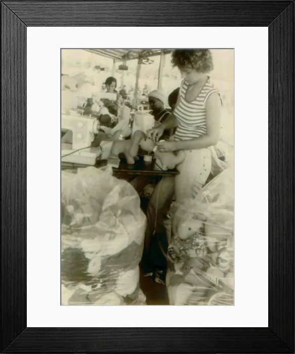 Framed Print : Barbara Cordell and Erin Leroy and others working on stuffed animal production. People's Temple Agricultural Project. Jonestown, Guyana. Nov. 1978