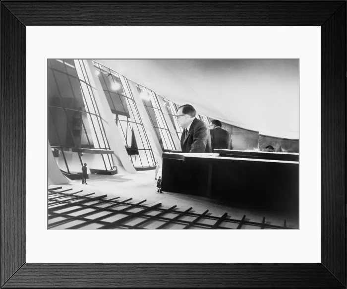 Framed Print : Eero Saarinen (1910-1961), Finish architect, standing inside model of the Dulles Airport terminal. 1958 Framed Print : Eero Saarinen (1910-1961), Finish architect, standing inside model of the Dulles Airport terminal. 1958