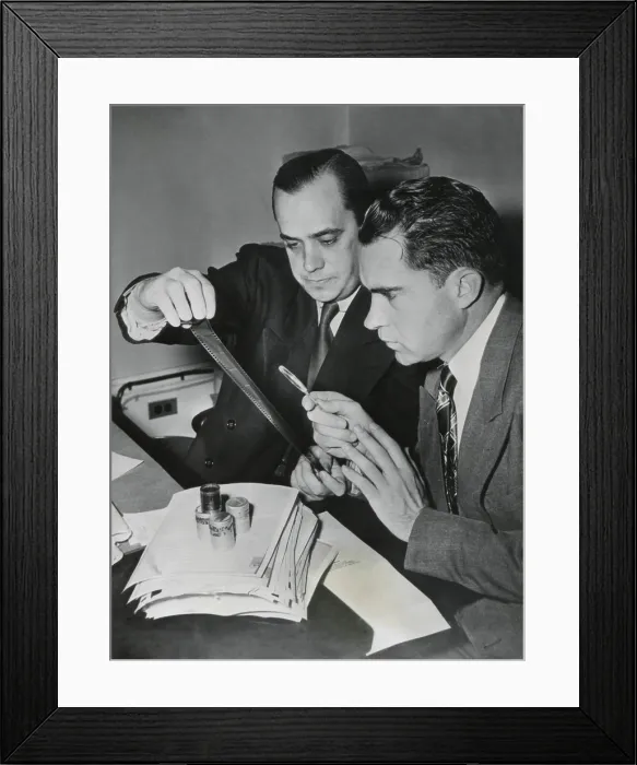 Framed Print : Richard Nixon examines the Pumpkin Paper microfilms with Robert Stripling, HUAC Chief Investigator. The film contained 64 U.S