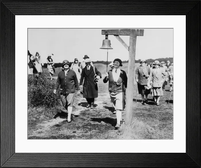 Framed Print : Molly Gourlay, ex-British women's open champion, at the Formby Ladies Golf Club. She rings the 7th tee all clear bell with her golf club, ca. 1930. (BSLOC_2013_9_23)