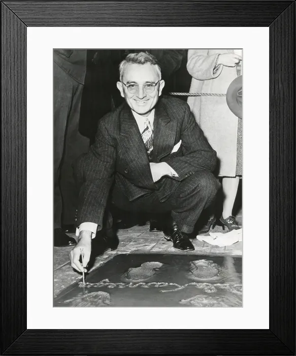 Framed Print : Dale Carnegie, signing his concrete slab at Grauman's Chinese Theatre