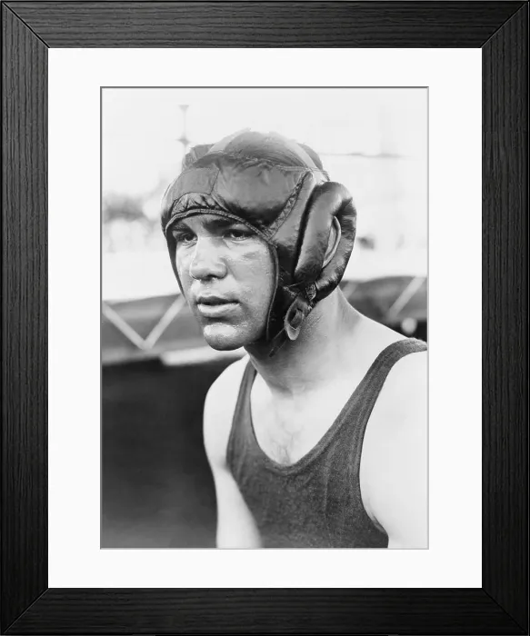Framed Print : Max Schmeling, wearing protective helmet, and Vaseline. He was training for the June 21, 1932 title bout with Jack Sharkey, which he lost. (BSLOC_2013_9_28)