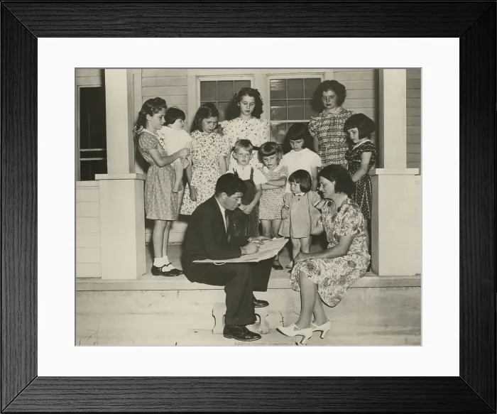 Framed Print : 1940 Census taker interviewing the mother of ten children. On their front porch, the family is well dressed and looks prosperous. (BSLOC_2013_9_4)