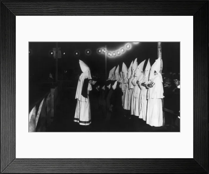 Framed Print : Four masked women kneeling in front of shrouded Klansman reading from a book. The Ku Klux Klan initiation ceremony took place on Long Island, New York in 1924. (BSLOC_2015_16_174) Framed Print : Four masked women kneeling in front of shrouded Klansman reading from a book. The Ku Klux Klan initiation ceremony took place on Long Island, New York in 1924. (BSLOC_2015_16_174)