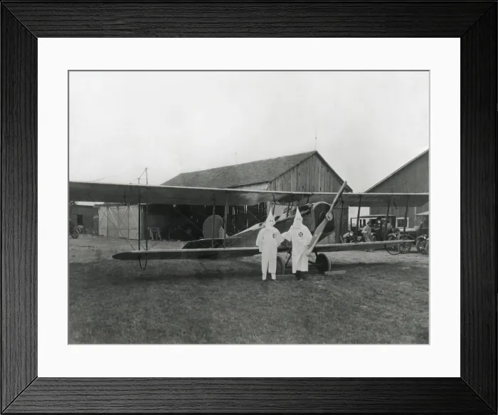 Framed Print : Two pilots in Ku Klux Klan shrouds pose with their aircraft in Dayton, Ohio in 1924. (BSLOC_2015_16_175)