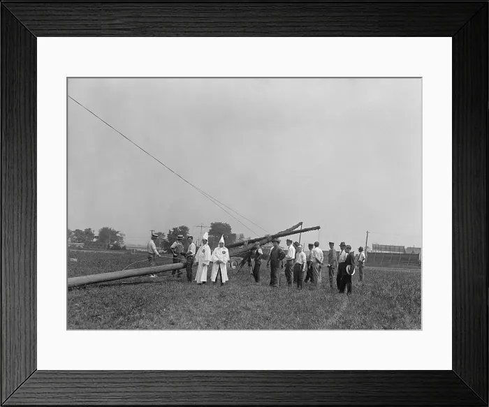 Framed Print : Two white robed Ku Klux Klansmen supervise the erection of 80 ft. cross in Arlington, Virginia. August 8, 1925 at the Arlington horse show grounds. (BSLOC_2015_16_176) Framed Print : Two white robed Ku Klux Klansmen supervise the erection of 80 ft. cross in Arlington, Virginia. August 8, 1925 at the Arlington horse show grounds. (BSLOC_2015_16_176)