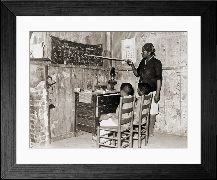 Framed Print : African American mother teaching children numbers and alphabet in their sharecropper home in Transylvania, Louisiana. 1937