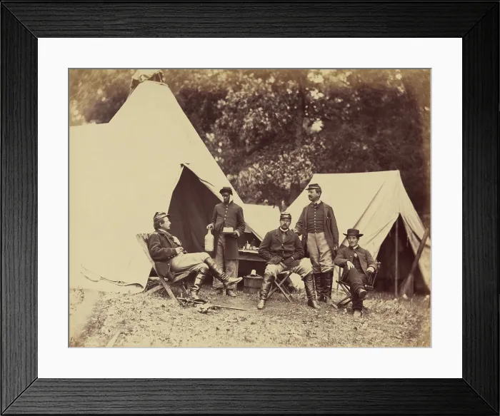 Framed Print : Posing for the camera, a White officer faces his young Black servant, who is holding bottle and cake