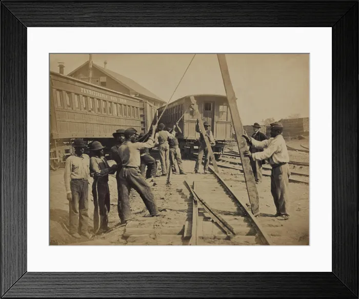 Framed Print : African American work crew in northern, Virginia, using levers for loosening rails, as part of the Union Military Railway Service. Ca. 1862 photo by Andrew J. Russell