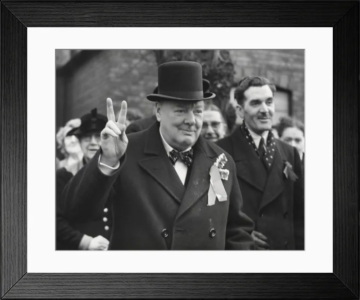 Framed Print : Conservative Party Leader Winston Churchill gives his familiar victory sign. He was making a last-minute campaign tour before the General Election. Woodford, Essex. Feb. 23, 1950