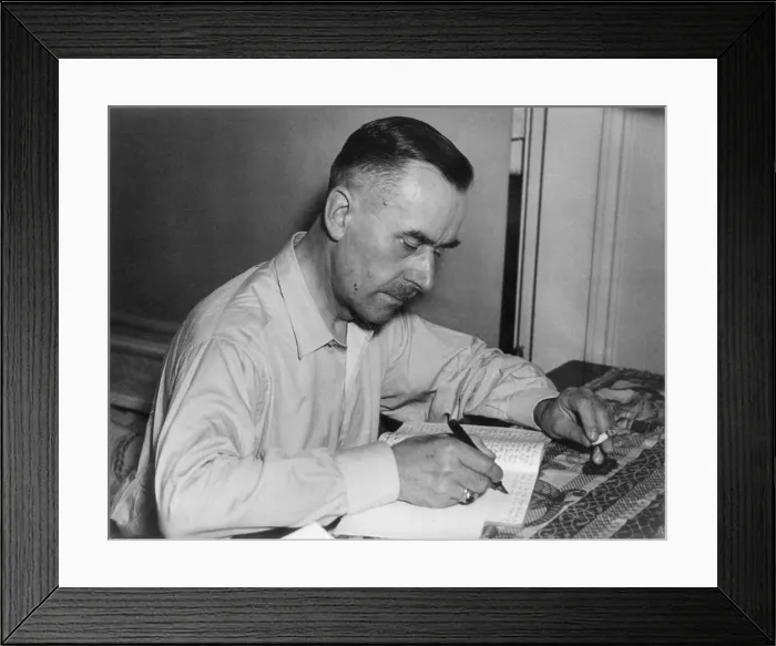 Framed Print : Thomas Mann, German writer and Nobel laureate, writing while holding cigarette. Ca. 1930. (BSLOC_2013_9_57)