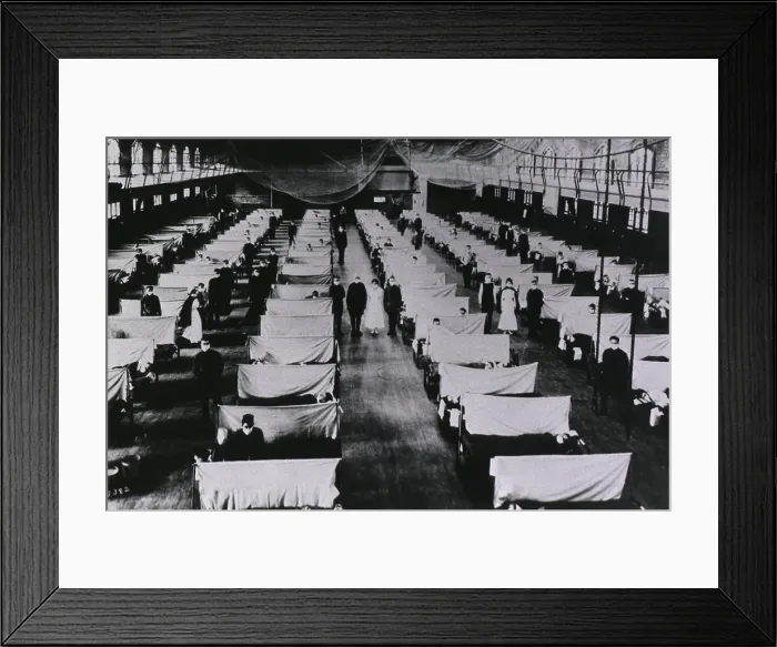 Framed Print : Spanish Flu Epidemic 1918-19. U.S. school gymnasium converted into an flu ward with patients beds are separated by screens and masked health workers