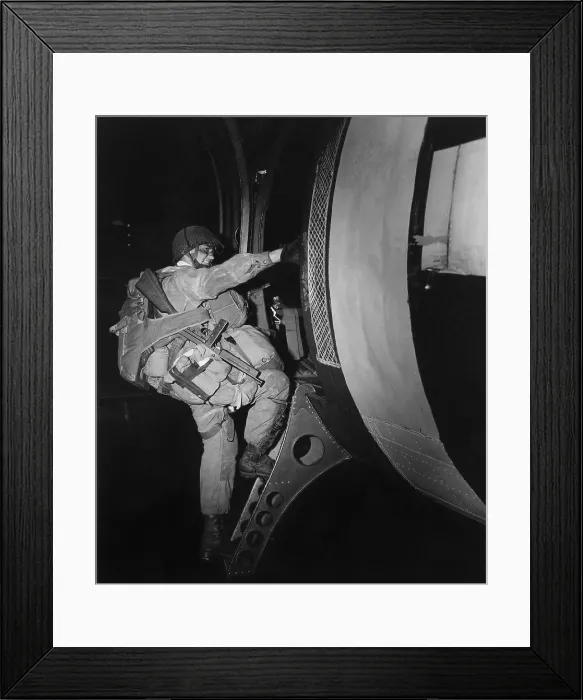 Framed Print : Fully loaded U.S. paratrooper climbs into a glider that will land behind the Normandy beaches