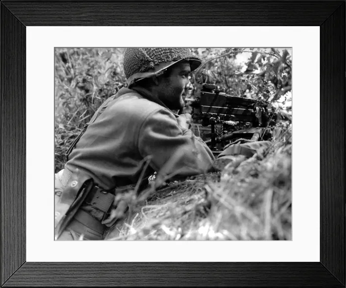 Framed Print : Soldier positioned in a ditch with gun Browning machine gun in Normandy, France. He is part of Operation Cobra, code name for First U.S Framed Print : Soldier positioned in a ditch with gun Browning machine gun in Normandy, France. He is part of Operation Cobra, code name for First U.S