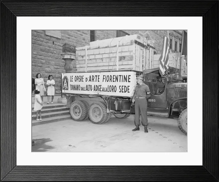 Framed Print : U.S. Soldier guards a truck holding stolen Italian artworks during World War 2. The crated paintings were stolen by the Nazi German army and returned by the U.S