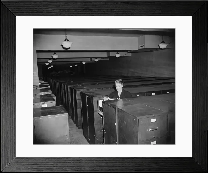 Framed Print : Remains of the defunct NRA three years after its closing. One manager with seven assistant attends over half an acre of filing cabinets Framed Print : Remains of the defunct NRA three years after its closing. One manager with seven assistant attends over half an acre of filing cabinets