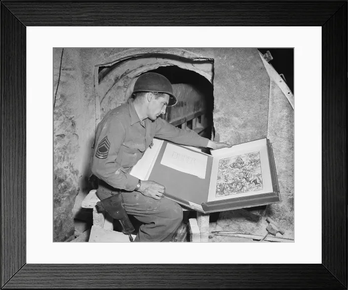 Framed Print : U.S. Army sergeant Harold Maus inspects a Durer engraving hidden in the Merkers salt mine