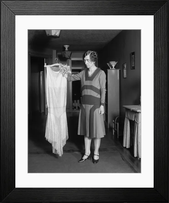 Framed Print : Young women quizzically evaluating new dress, May 14, 1925. (BSLOC_2015_16_248)