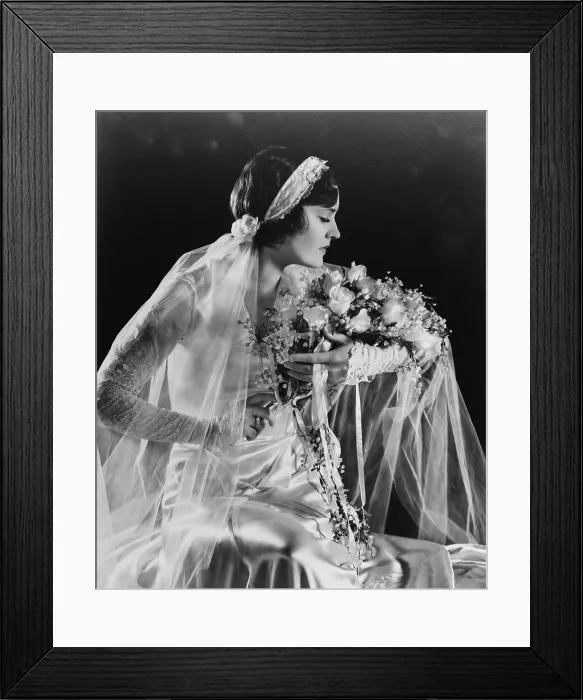 Framed Print : Woman in wedding gown, holding flowers, 1932. (BSLOC_2015_16_247)