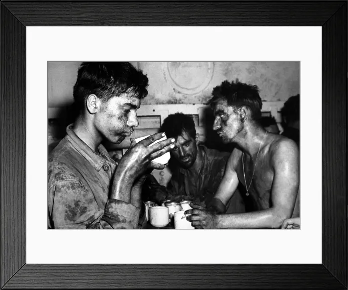 Framed Print : U.S. Marines after two days and nights of fighting on Eniwetok Island against Japanese. Marine holding the coffee cup is 19 year old Pfc. Faris Tuoly. Feb. 1944