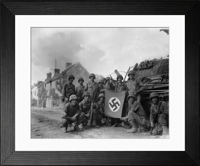 Framed Print : U.S. Soldiers display a captured swastika flag on August 20, 1944. Two days after the Battle of the Falaise Pocket, they were left behind to mop-up in Chambois