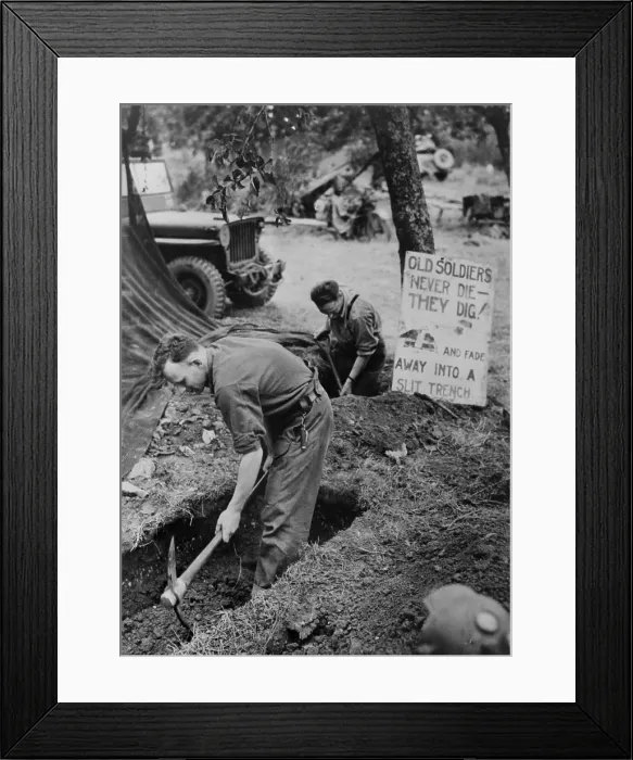 Framed Print : Canadian troops in Normandy digging trenches outside their tents. A sign reads, Old soldiers never die--they dig! and fade away into a slit trench. Summer 1944 Framed Print : Canadian troops in Normandy digging trenches outside their tents. A sign reads, Old soldiers never die--they dig! and fade away into a slit trench. Summer 1944