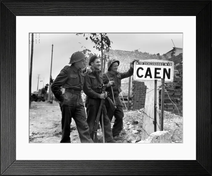 Framed Print : Canadian soldiers at a sign for the port city of Caen, their first critical Post D-Day objective. July 9, 1944. Normandy Campaign, France, World War 2. (BSLOC_2014_2_130)