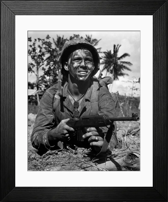 Framed Print : A Marine awaits the signal to go into battle to recapture Guam from Japanese forces. July 1944. (BSLOC_2013-12_218)