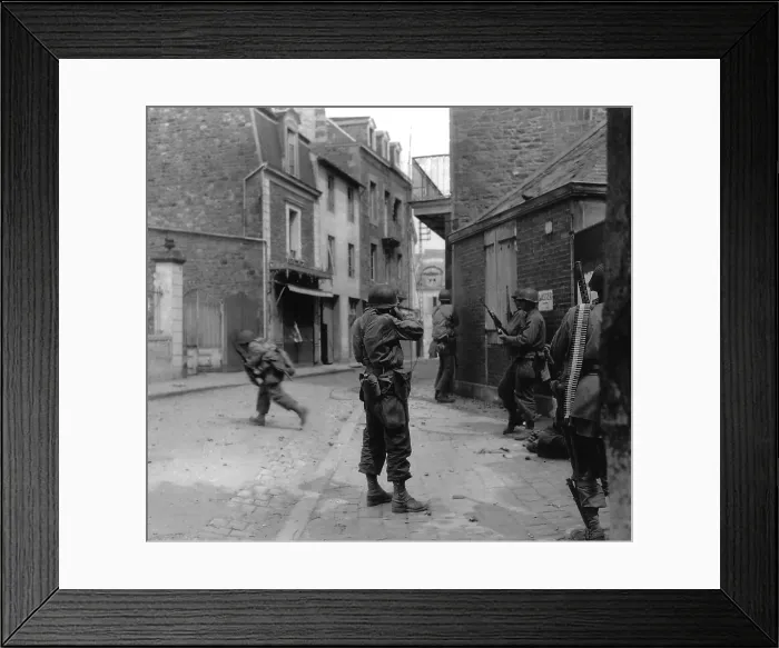 Framed Print : U.S. soldier aims at a German sniper during street fighting in Saint Malo, France, Aug. 8, 1944. The Atlantic port city was captured on Aug. 17, 1944, with the 10, 000 German POWS