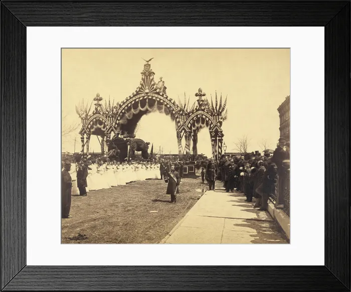 Framed Print : Assassinated President Lincoln's hearse is accompanied by women dressed in white as it passes beneath an ornate arch at 12th Street in Chicago, Illinois. May 1-3. 1865
