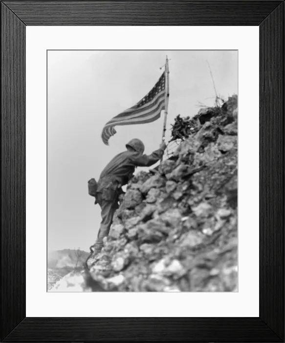 Framed Print : Marine 1st Battalion commander braved sniper fire to place a flag on Shuri Castle, Okinawa. May 30, 1945. The same flag was first raised over Cape Gloucester and then Peleliu