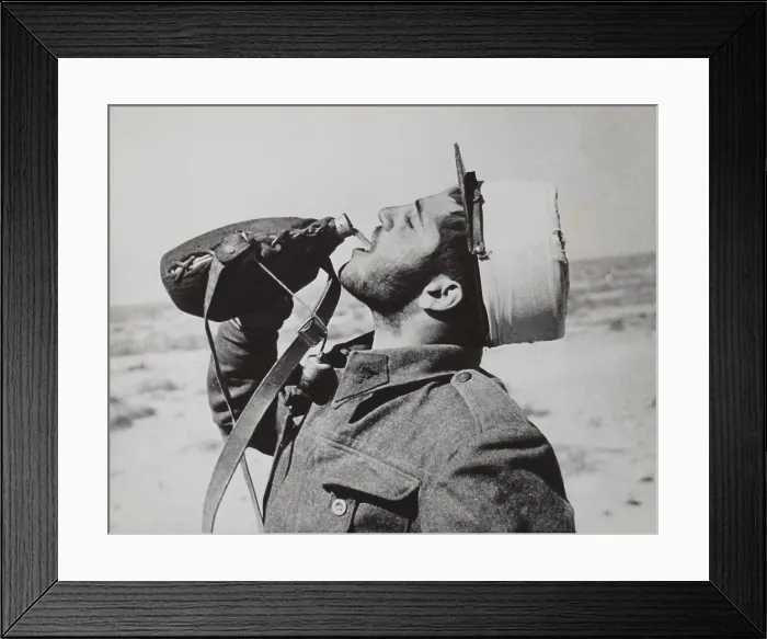 Framed Print : Free French soldier drinking from his canteen in the Western Desert in 1942 Framed Print : Free French soldier drinking from his canteen in the Western Desert in 1942