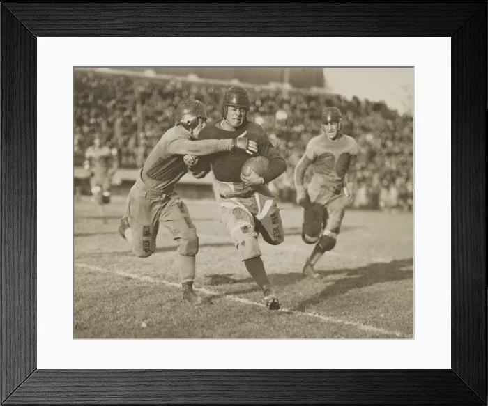 Framed Print : 1920s football action. Hundreds of spectators watch from stadium seats. (BSLOC_2015_17_124) Framed Print : 1920s football action. Hundreds of spectators watch from stadium seats. (BSLOC_2015_17_124)