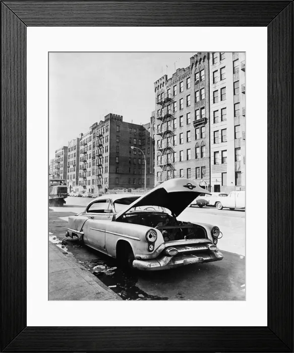 Framed Print : Bronx street in New York City. An abandoned automobile, a vacant lot and tenement apartments on Macombs Road. Ca. 1964 Framed Print : Bronx street in New York City. An abandoned automobile, a vacant lot and tenement apartments on Macombs Road. Ca. 1964
