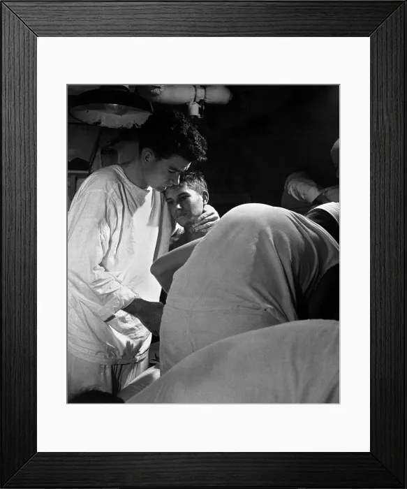 Framed Print : Pvt. J.B. Slagle, receives his daily dressing of wounds. He is on board USS SOLACE, a military hospital ship enroute from Okinawa to Guam. May 1945. World War 2