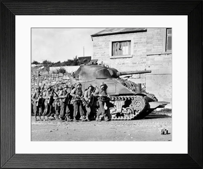 Framed Print : U.S. soldiers advance into a Belgian town under the protection of a heavy tank. Sept. 9, 1944 during World War 2. (BSLOC_2014_2_171)