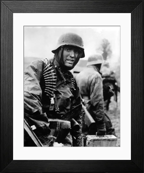 Framed Print : Heavily armed German soldiers advancing in Belgium through thin American lines. Dec. 16-22, 1944. Still from a captured German film. Battle of the Bulge, World War 2