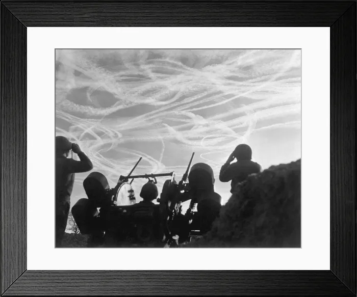 Framed Print : Christmas Day dogfights streaked the sky with vapor trails from Allied and German planes. Soldiers of an anti-aircraft battery watch the action over Puffendorf, Germany. Dec Framed Print : Christmas Day dogfights streaked the sky with vapor trails from Allied and German planes. Soldiers of an anti-aircraft battery watch the action over Puffendorf, Germany. Dec