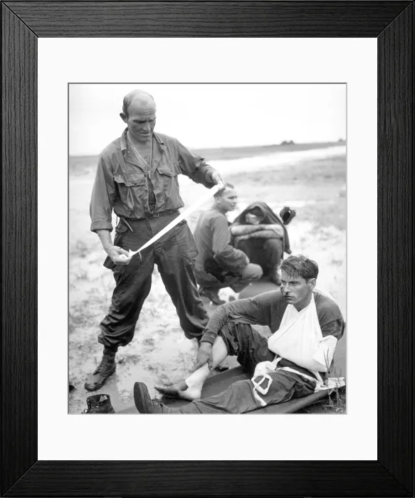 Framed Print : Soldiers aided by corpsmen after their tank hit a land mine during the Philippine invasion. Oct. 20, 1944, Leyte Island. World War 2, Pacific Ocean. (BSLOC_2013_13_37)