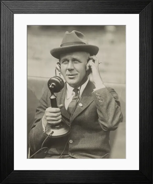 Framed Print : Sports Journalist Grantland Rice using telephone microphone in the 1920s. Rice wrote his syndicated column, THE SPORTLIGHT, for New York Tribune. (BSLOC_2015_17_148)