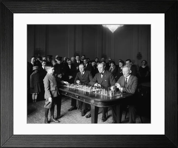 Framed Print : Chess prodigy, Samuel Herman Reshevsky, in a simultaneous chess exhibition match, April 6, 1922. The 10 year old was on an U.S