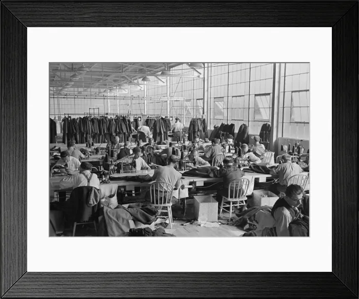 Framed Print : Cooperative garment factory at Jersey Homesteads, showing homesteaders at their work and some of the ladies coats made by them. Nov. 1936